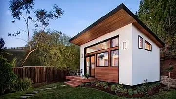 Modern tiny house with wooden accents.