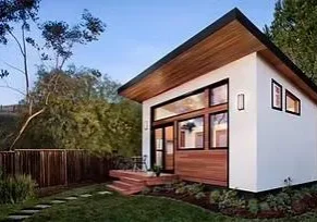 Modern tiny house with wooden accents.